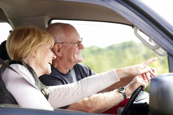 Elderly Couple Driving