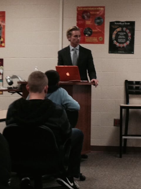 Attorney Brandon Hewitt speaks on distracted driving at the Byron Center in Grand Rapids