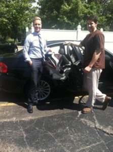 Attorney Brandon Hewitt and Jon ONeill during car seat safety inspection
