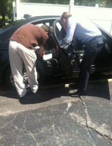 Jon gives attorney Brandon Hewitt a few car seat installation tips. 