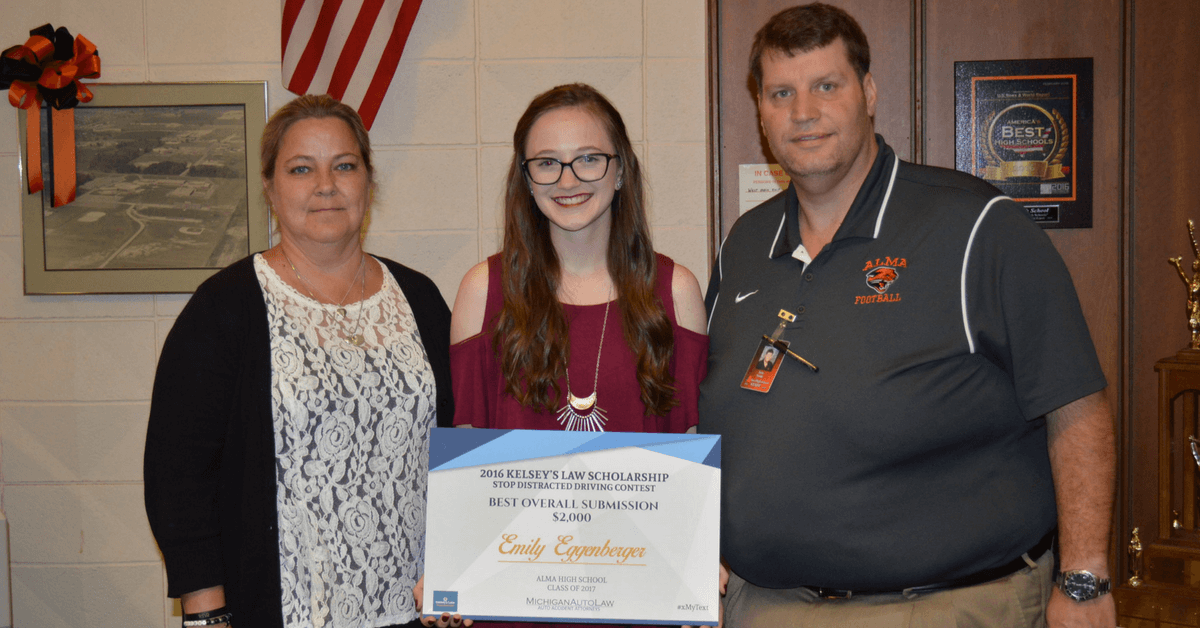 Pictured: Emily Eggenberger with Bonnie Raffaele and Principal Torok at Alma High School