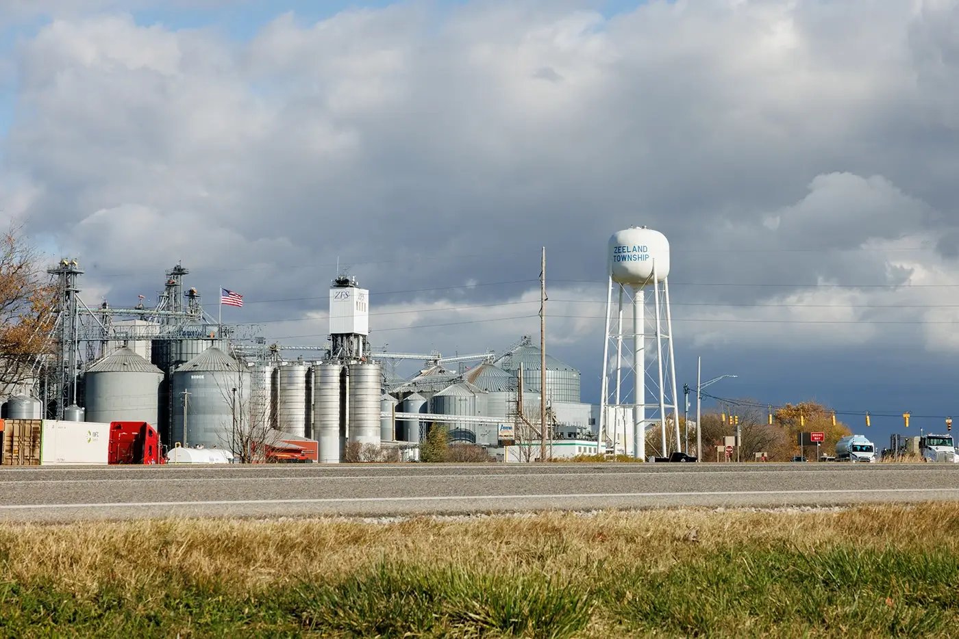 Zeeland water tower and roadway, showing where Michigan Auto Law supports drivers as a car accident attorney.