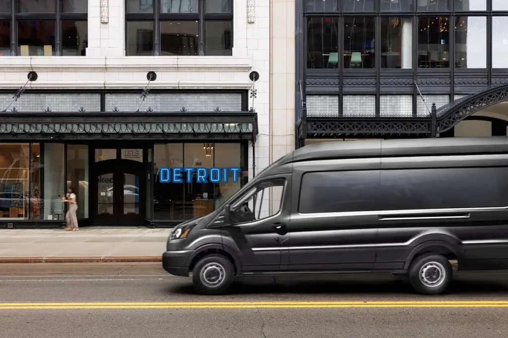 Van driving through downtown Detroit, where Michigan Auto Law helps victims as a car crash attorney in Detroit.