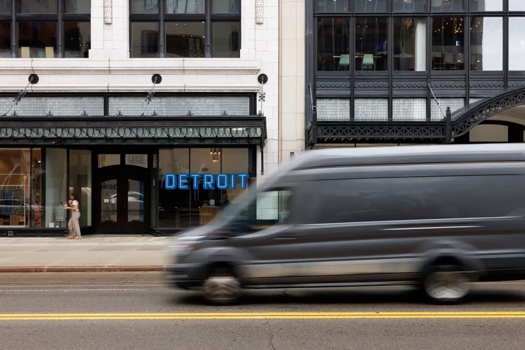 Van driving through downtown Detroit, where Michigan Auto Law helps victims as a car crash attorney in Detroit.