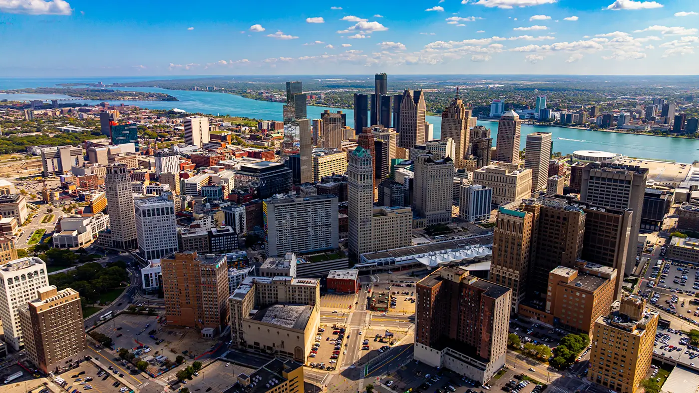 Detroit skyline and waterfront in an aerial view, illustrating a Detroit Lyft accident law firm.