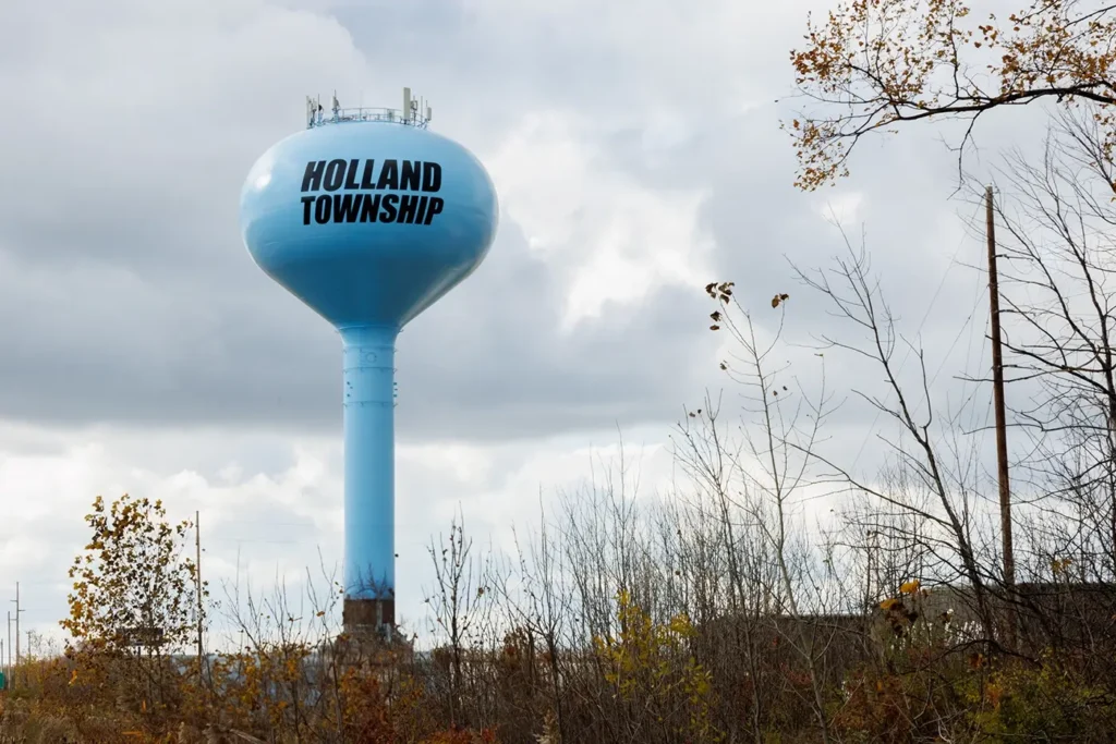  Blue Holland Township water tower, reflecting Michigan Auto Law’s work as a Holland car accident lawyer.