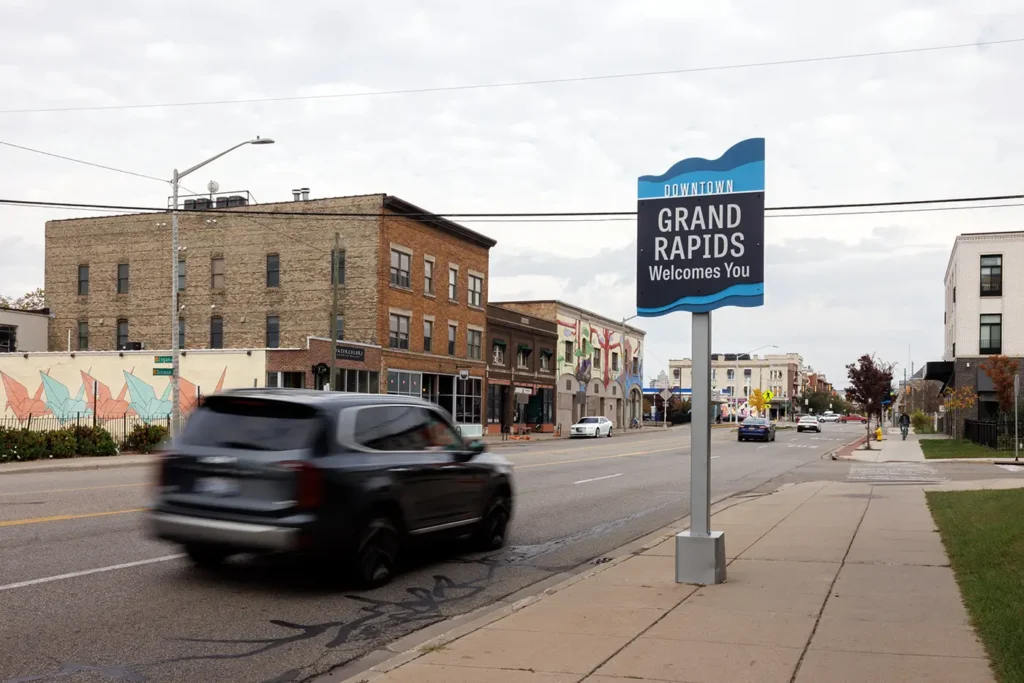 Downtown Grand Rapids roadway with passing cars, where Michigan Auto Law serves as a Lyft accident attorney in Grand Rapids.