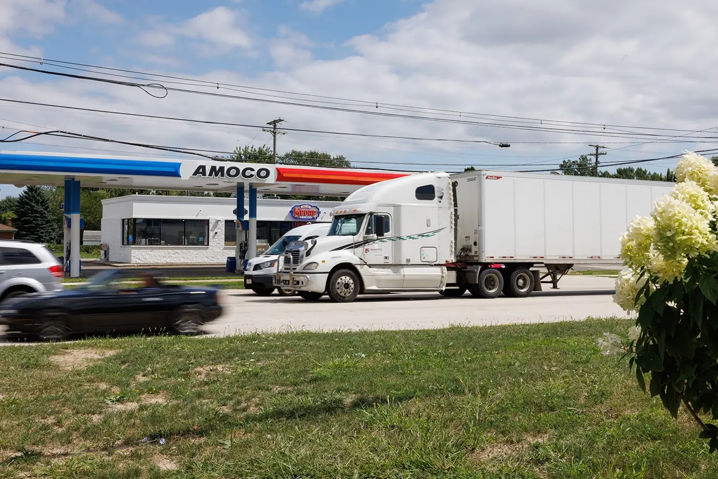 Commercial truck traveling through Warren, showing the area served by Michigan Auto Law as a truck accident attorney.