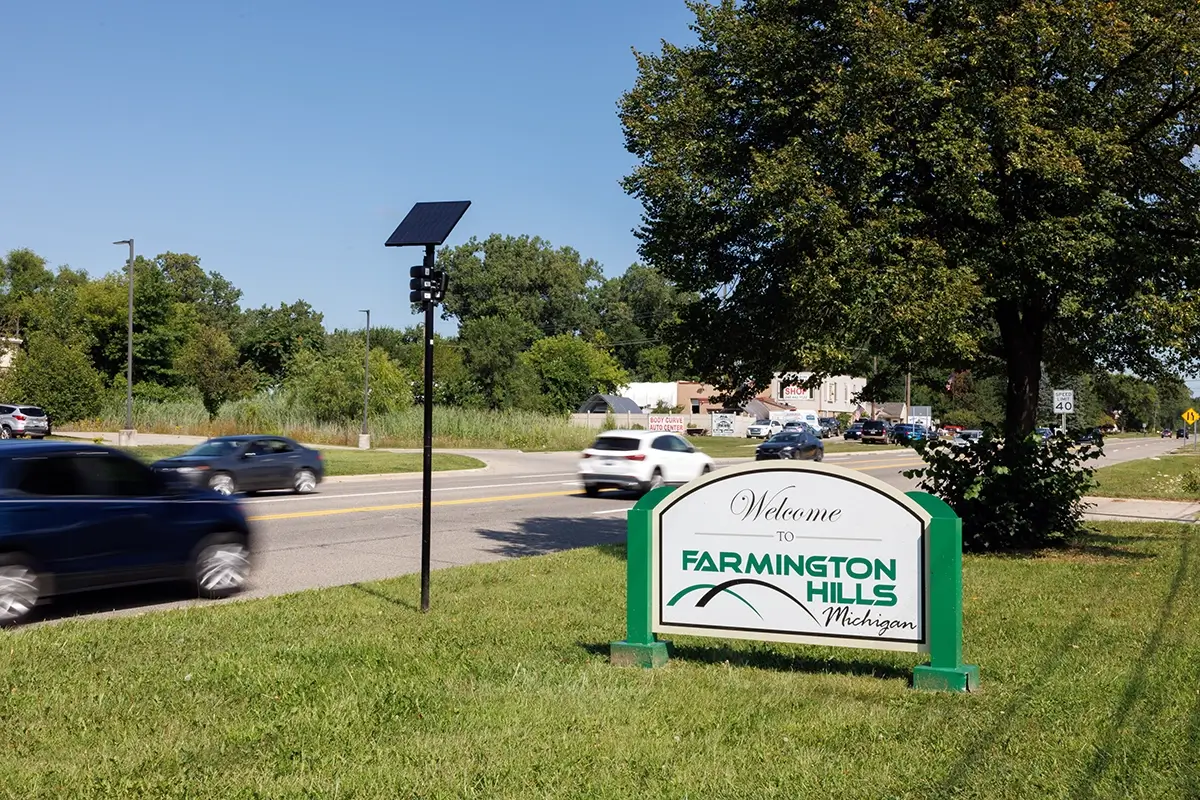 Roadside Welcome to Farmington Hills sign illustrating car accident law firm Farmington Hills representation.