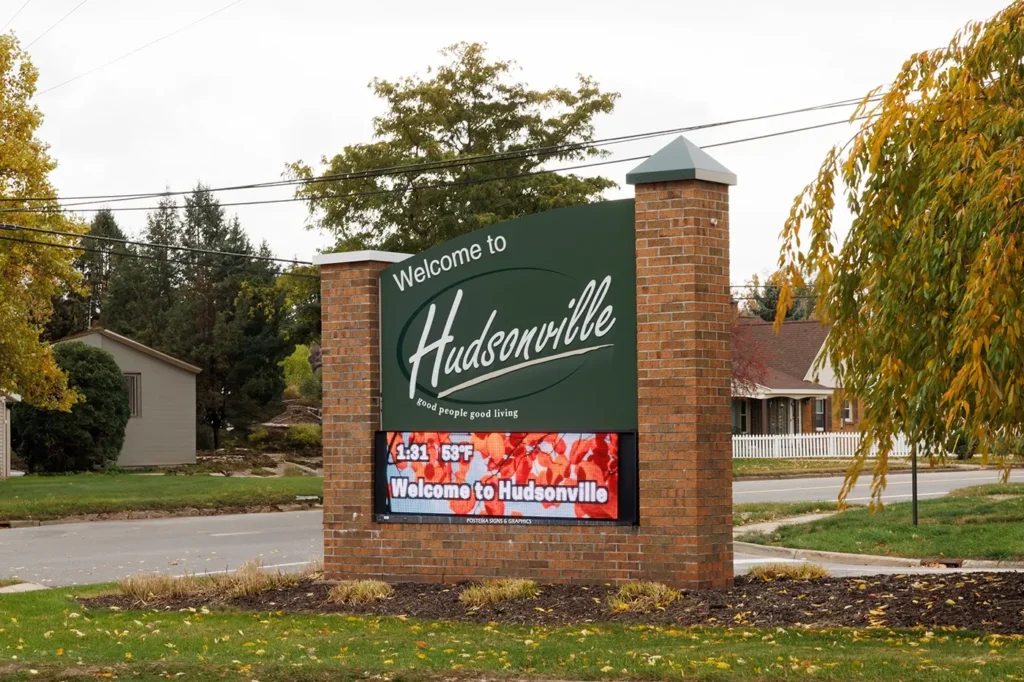 City sign reflecting Michigan Auto Law’s work for car crash cases in Hudsonville.