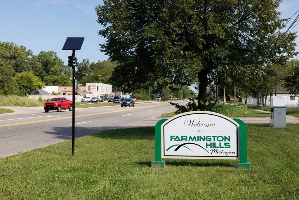 Farmington Hills welcome sign along a major road, representing Lyft accident lawyer Farmington Hills services.