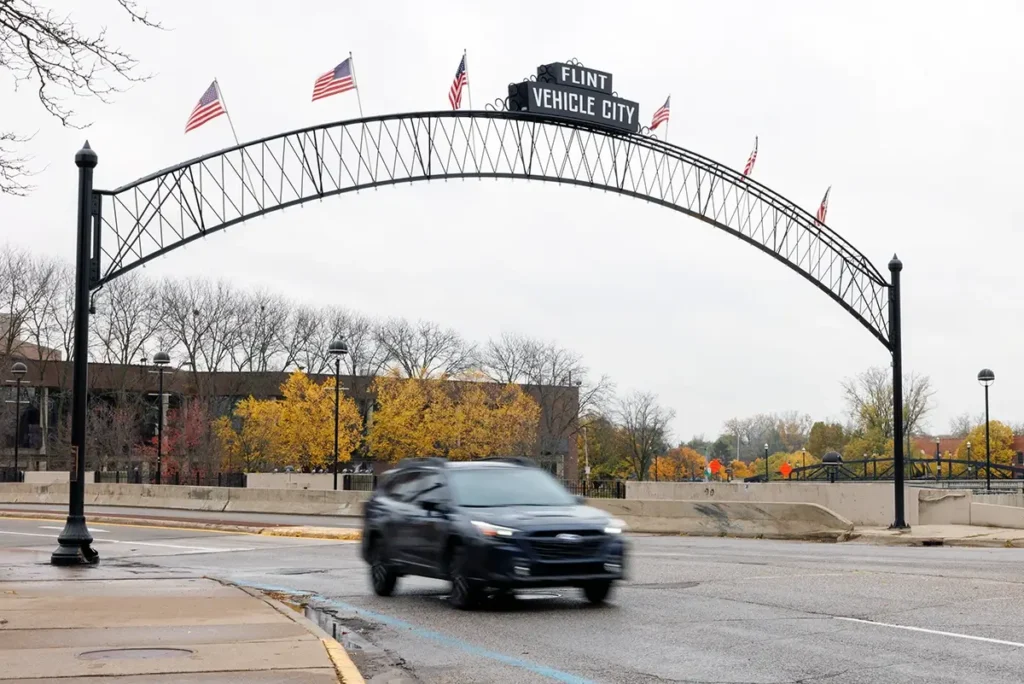 Downtown Flint roadway and Vehicle City landmark representing Michigan Auto Law help after Lyft accidents.