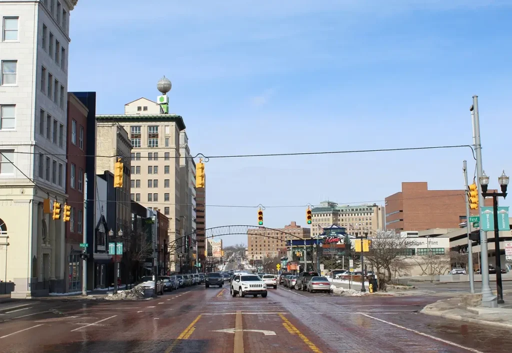  Downtown Flint roadway representing Michigan Auto Law Lyft crash lawyer support after rideshare accidents.